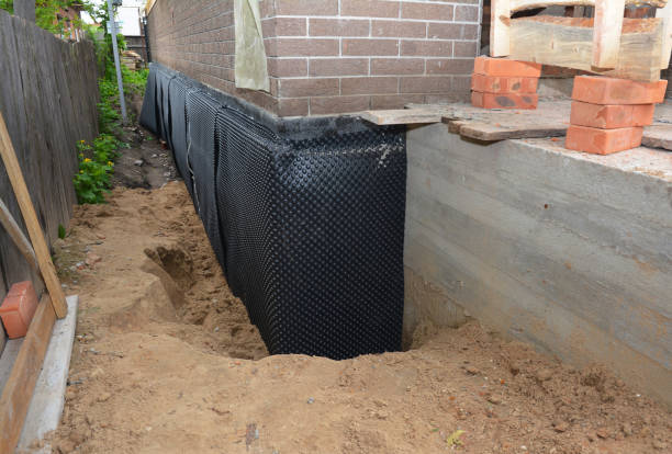 SJ Waterproofing Pros technician performing targeted Waterproofing assessment in Hughesville, PA